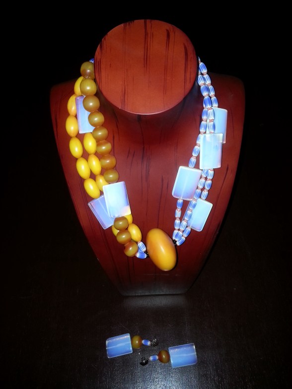 OMA STYLE IS INNATE- necklace designed by Eeefy Amber is found in Bauchi State, Nigeria Moonstone is from the luxurious climes of Plateu State Chevron is found in YOLA, Adamawa, Nigeria HEALING PROPERTIES:  Amber aides memory loss, purifies the body, elevates headaches and bone and hart problems.. Known for its stress relieving and calming properties.  Moonstone is a connection to the magic of the moon, protection for traveler, gift of lovers for passion, chanel of prophesy and a part to wisdom. It influences behaviors, emotions and spiritual growth.  