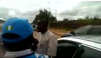 man-pulls-gun-on-frsc-officials1