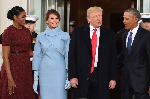 US President Barack Obama(R) and First Lady Michelle Obama(L) welcome Preisdent-elect Donald Trump(2nd-R) and his wife Melania to the White House in Washington, DC January 20, 2017. / AFP / JIM WATSON (Photo credit should read JIM WATSON/AFP/Getty Images)